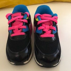 Black, bright pink, and blue air max nike